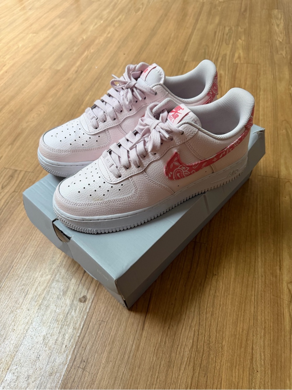 Nike Women's Low-Top Sneakers in Light Pink with Paisley Swoosh
